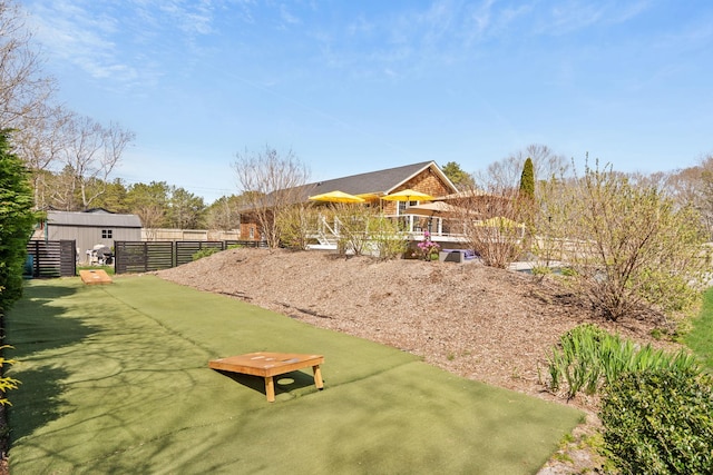 view of yard featuring fence and a patio