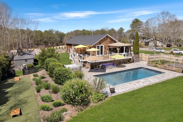 view of pool featuring a gazebo, a fenced backyard, and a lawn