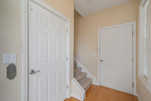 10 Symphony Dr, Lake Grove, NY 11755 - interior space featuring stairs, baseboards, and light wood-style floors