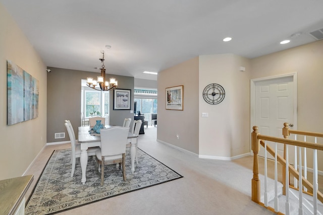 10 Symphony Dr, Lake Grove, NY 11755 - dining area featuring recessed lighting, a notable chandelier, light carpet, and baseboards