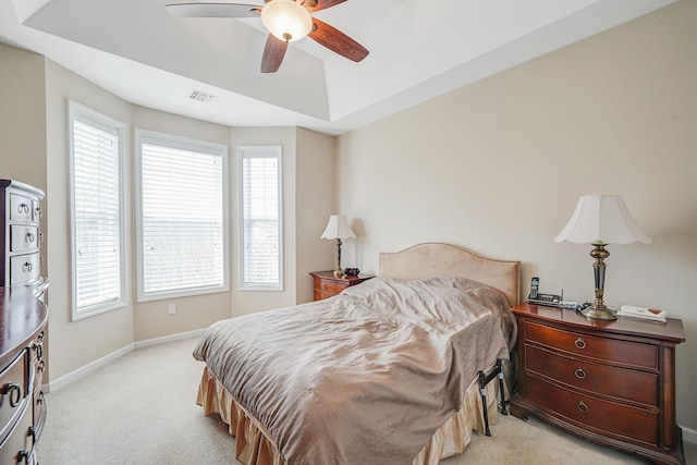 10 Symphony Dr, Lake Grove, NY 11755 - bedroom with multiple windows, baseboards, a ceiling fan, and light carpet