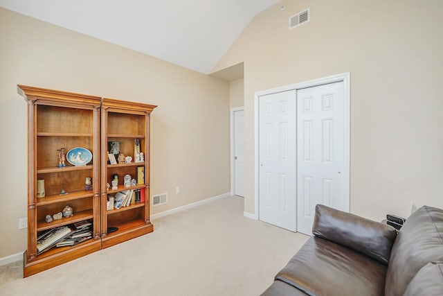 10 Symphony Dr, Lake Grove, NY 11755 - living area with visible vents, vaulted ceiling, light carpet, and baseboards