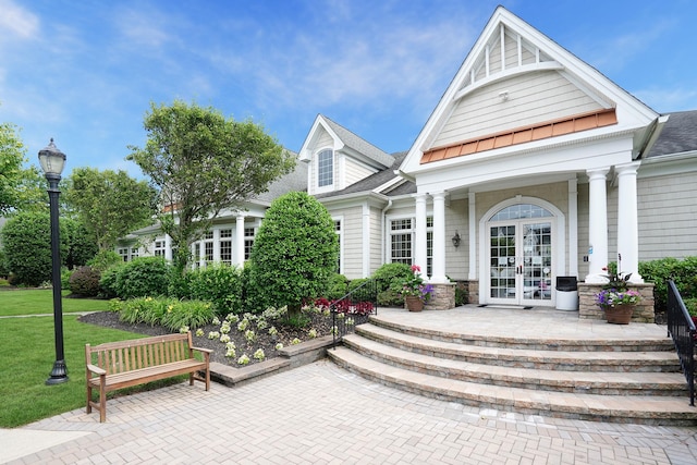 10 Symphony Dr, Lake Grove, NY 11755 - exterior space with roof with shingles, covered porch, a yard, and french doors