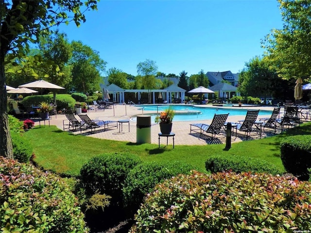 10 Symphony Dr, Lake Grove, NY 11755 - pool with a lawn and a patio area