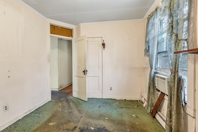 unfurnished bedroom featuring a baseboard radiator, concrete floors, crown molding, and baseboards