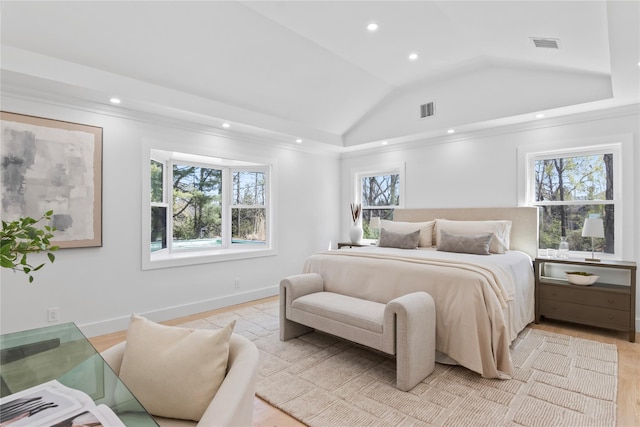 bedroom featuring recessed lighting, visible vents, lofted ceiling, and light wood-type flooring