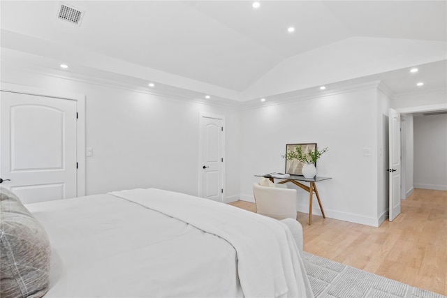bedroom featuring visible vents, crown molding, light wood-type flooring, lofted ceiling, and recessed lighting