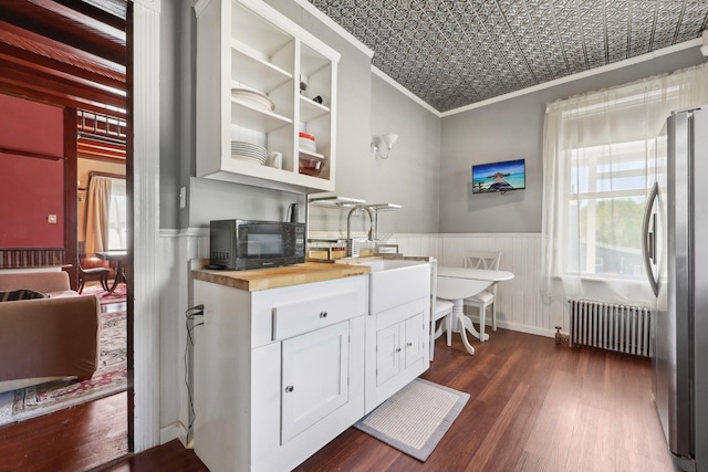 10 Wheeler Ave, Warwick, NY 10990 - kitchen featuring crown molding, dark wood-style flooring, black microwave, plenty of natural light, and radiator heating unit