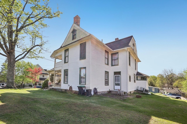 10 Wheeler Ave, Warwick, NY 10990 - rear view of property with entry steps, a chimney, and a yard