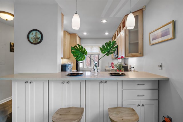 interior space with pendant lighting and recessed lighting