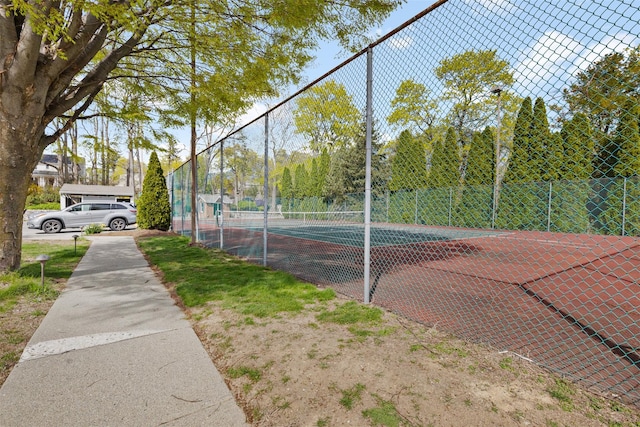 view of sport court with fence