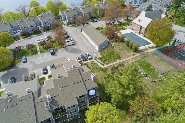 birds eye view of property with a residential view