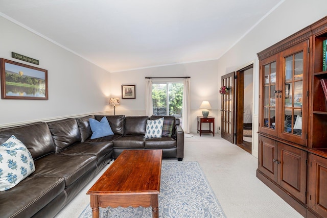 living room with light carpet and ornamental molding