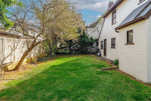 view of yard with fence