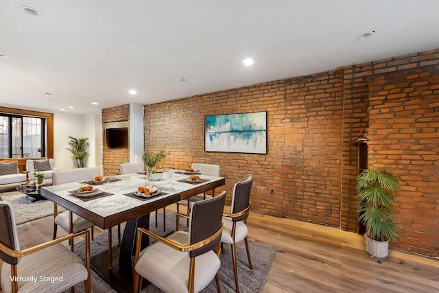 201 Madison St, Brooklyn, NY 11216 - dining space featuring recessed lighting, brick wall, and light wood-type flooring