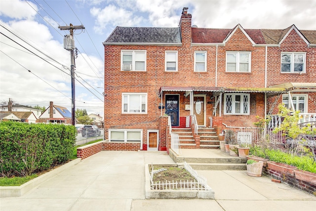 225-54 Murdock Ave, Queens Village, NY 11429 - multi unit property with fence, roof with shingles, a chimney, and brick siding