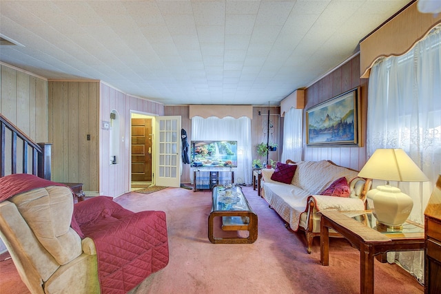 225-54 Murdock Ave, Queens Village, NY 11429 - living area with wood walls, stairway, and carpet flooring