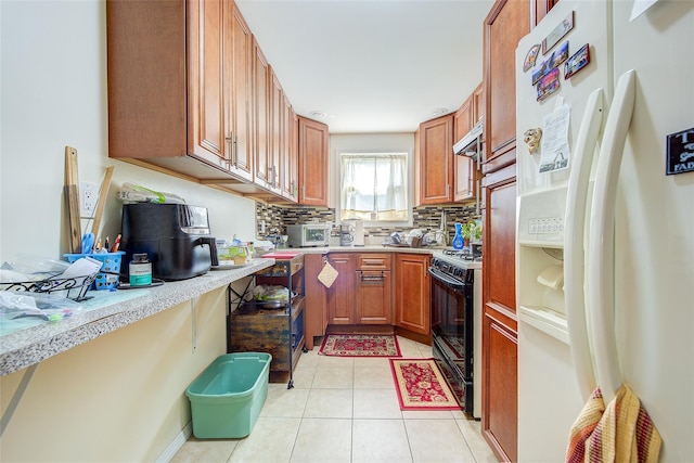 225-54 Murdock Ave, Queens Village, NY 11429 - kitchen with white refrigerator with ice dispenser, black gas stove, range hood, and light countertops