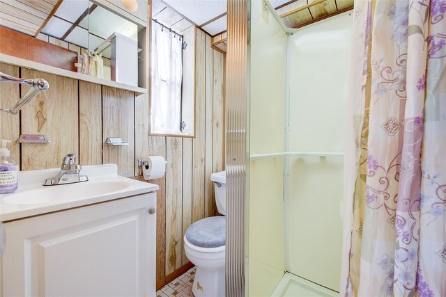 225-54 Murdock Ave, Queens Village, NY 11429 - full bathroom featuring wooden walls, a stall shower, toilet, and vanity