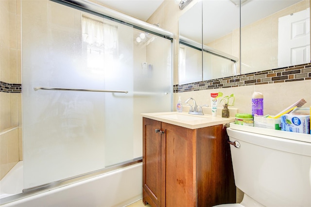 225-54 Murdock Ave, Queens Village, NY 11429 - bathroom with toilet, vanity, bath / shower combo with glass door, and decorative backsplash