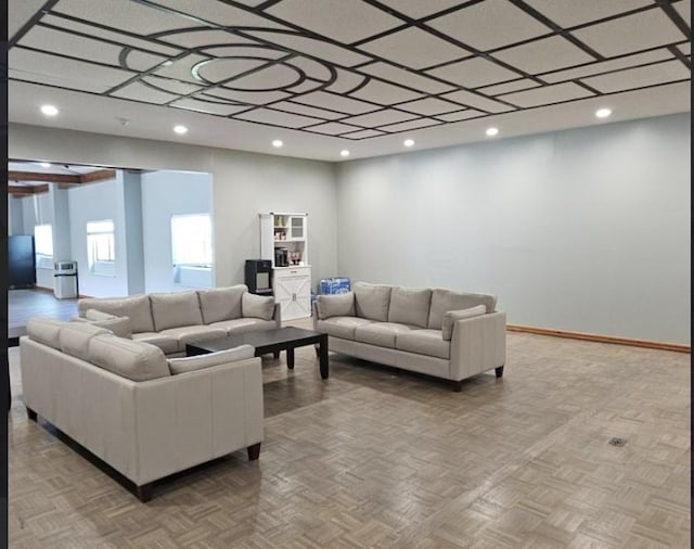living area with recessed lighting and baseboards