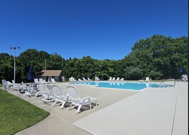 community pool with a patio