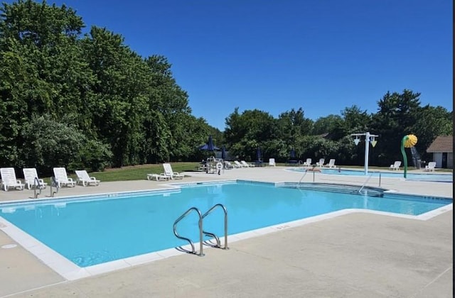 community pool featuring a patio