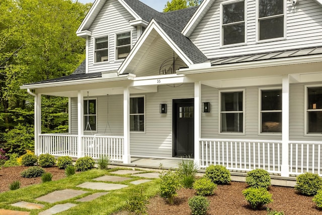 16 Anderson Rd, Pawling, NY 12564 - view of front of house with a porch, a standing seam roof, a shingled roof, and metal roof