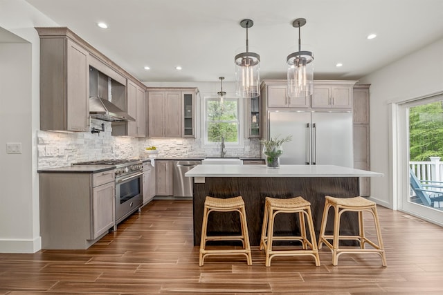 16 Anderson Rd, Pawling, NY 12564 - kitchen with premium appliances, wall chimney range hood, a sink, decorative backsplash, and glass insert cabinets