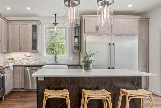16 Anderson Rd, Pawling, NY 12564 - kitchen with appliances with stainless steel finishes, a sink, recessed lighting, glass insert cabinets, and a kitchen breakfast bar