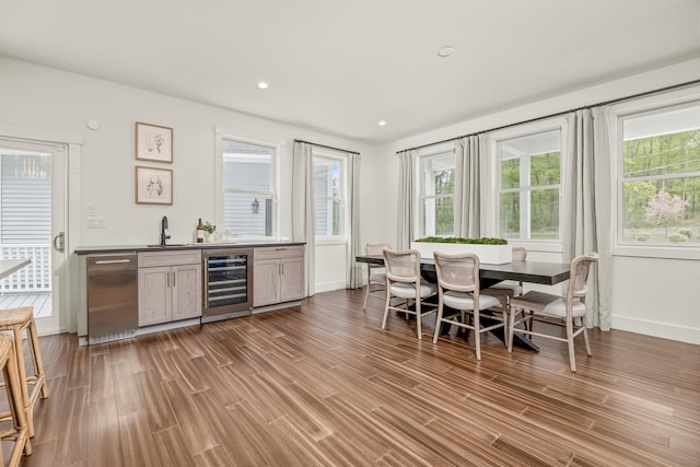 16 Anderson Rd, Pawling, NY 12564 - indoor bar featuring beverage cooler, stainless steel dishwasher, plenty of natural light, wood finished floors, and recessed lighting