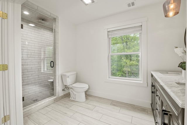 16 Anderson Rd, Pawling, NY 12564 - full bathroom featuring a shower stall, double vanity, toilet, baseboards, and wood finish floors