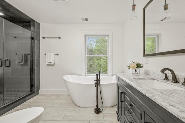 16 Anderson Rd, Pawling, NY 12564 - bathroom featuring vanity, a stall shower, a soaking tub, toilet, and baseboards
