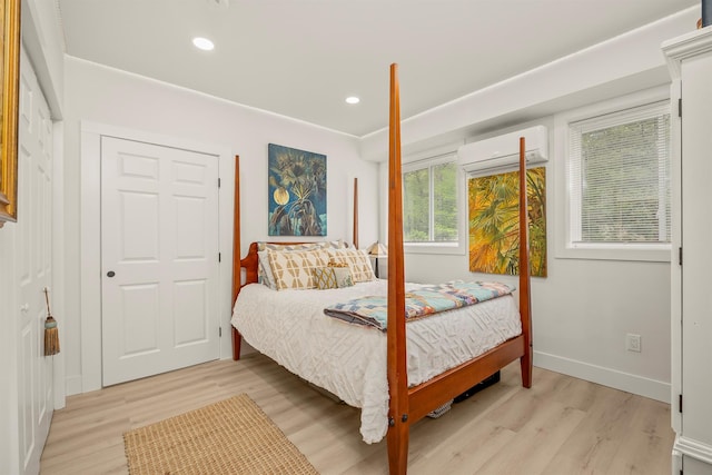 16 Anderson Rd, Pawling, NY 12564 - bedroom with a wall mounted AC, light wood-style flooring, recessed lighting, and baseboards