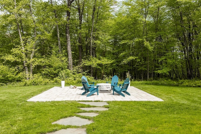16 Anderson Rd, Pawling, NY 12564 - view of grassy yard with a patio, a fire pit, and a forest view