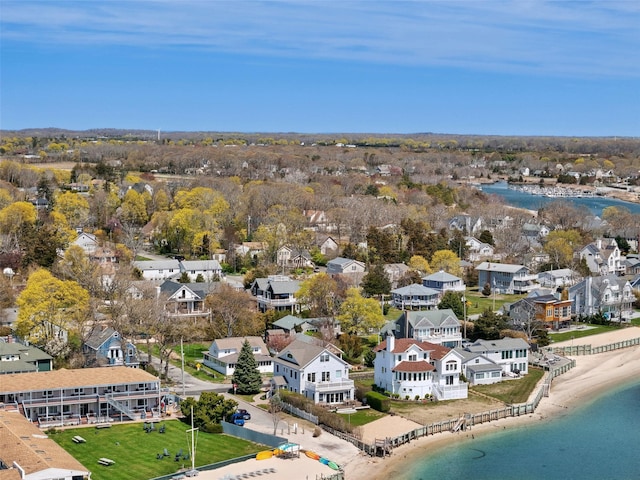 drone / aerial view featuring a water view and a residential view