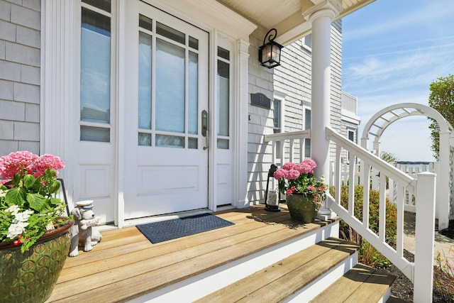 view of exterior entry featuring a porch