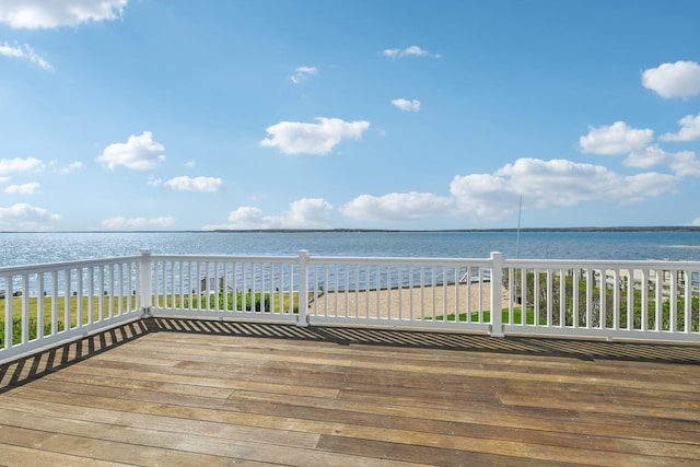 wooden deck featuring a water view