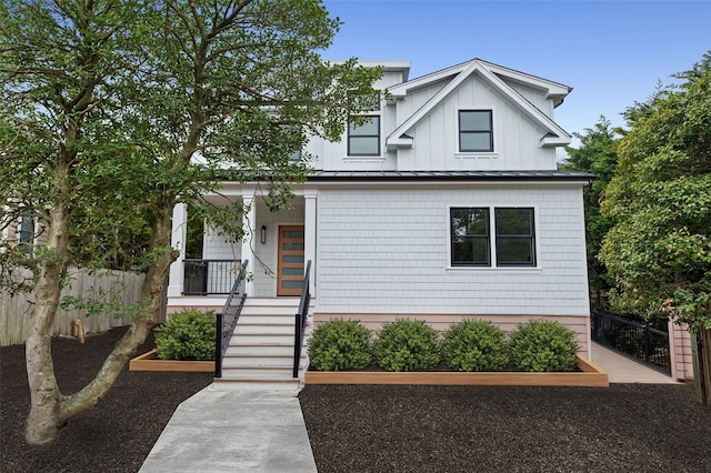 260 Wilmot Rd, Ocean Beach, NY 11770 - view of front of house with a porch, fence, a standing seam roof, and metal roof
