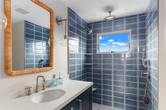 260 Wilmot Rd, Ocean Beach, NY 11770 - bathroom with vanity, tiled shower, and visible vents