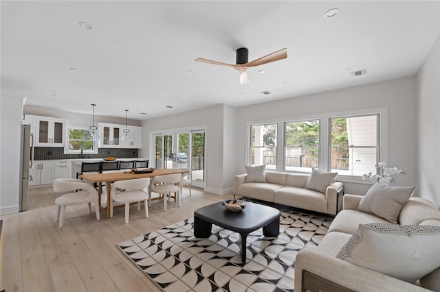 260 Wilmot Rd, Ocean Beach, NY 11770 - living room with visible vents, baseboards, ceiling fan, light wood-type flooring, and recessed lighting