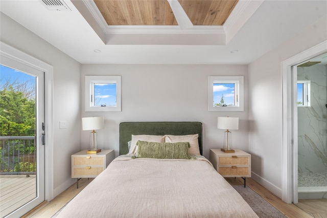 260 Wilmot Rd, Ocean Beach, NY 11770 - bedroom with visible vents, ornamental molding, access to exterior, a tray ceiling, and light wood-style flooring