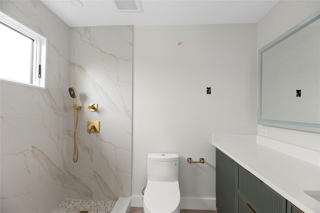 260 Wilmot Rd, Ocean Beach, NY 11770 - bathroom with visible vents, vanity, toilet, baseboards, and a marble finish shower