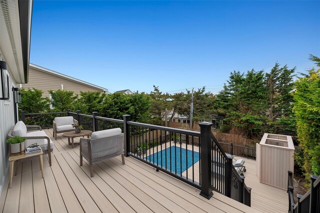 260 Wilmot Rd, Ocean Beach, NY 11770 - wooden deck featuring a fenced in pool and outdoor lounge area