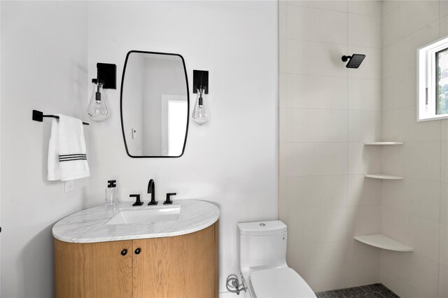 260 Wilmot Rd, Ocean Beach, NY 11770 - bathroom featuring toilet, tiled shower, and vanity