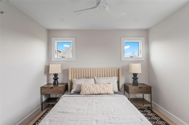 260 Wilmot Rd, Ocean Beach, NY 11770 - bedroom featuring baseboards, multiple windows, and wood finished floors