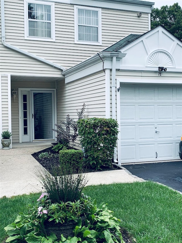 property entrance with a garage