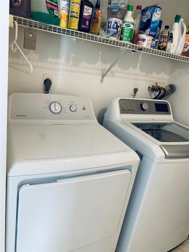 laundry room featuring laundry area and washer and clothes dryer