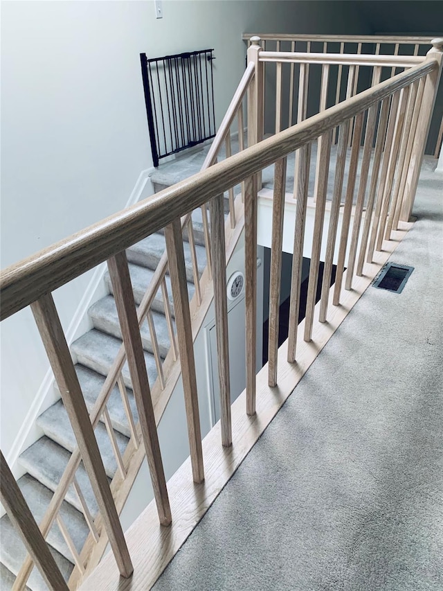 stairs featuring carpet and visible vents
