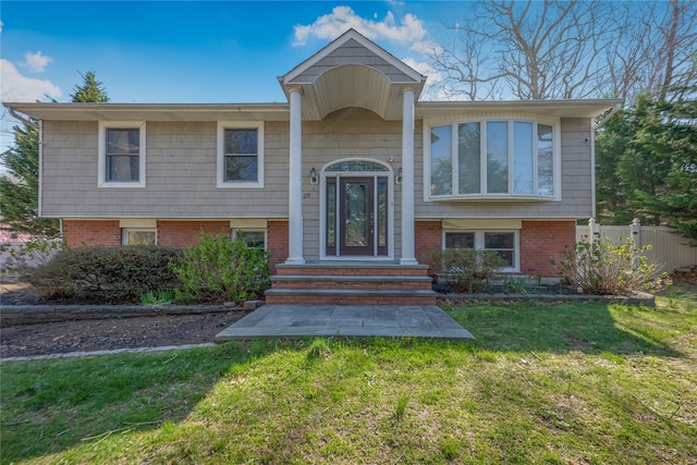 29 Fairway Dr, Rocky Point, NY 11778 - bi-level home featuring a front lawn and fence